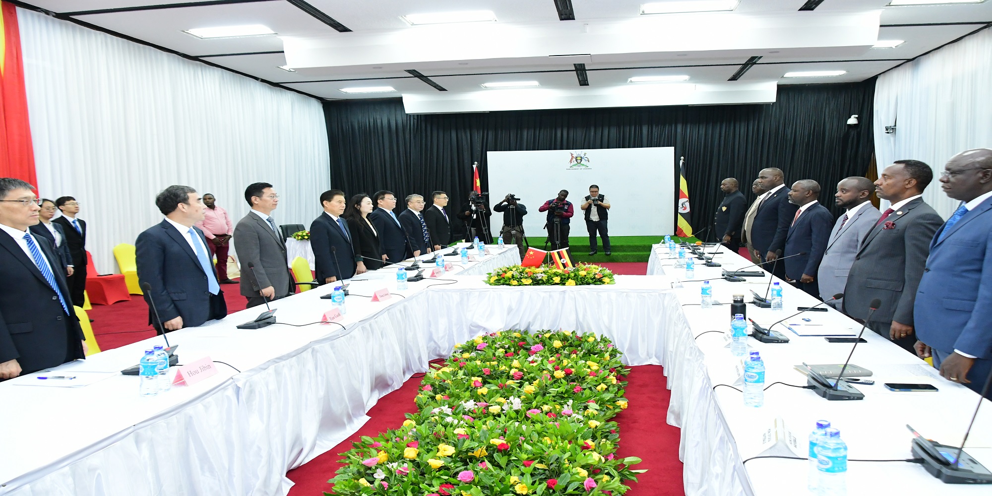 The Chinese and Ugandan parties settling down for the talks 