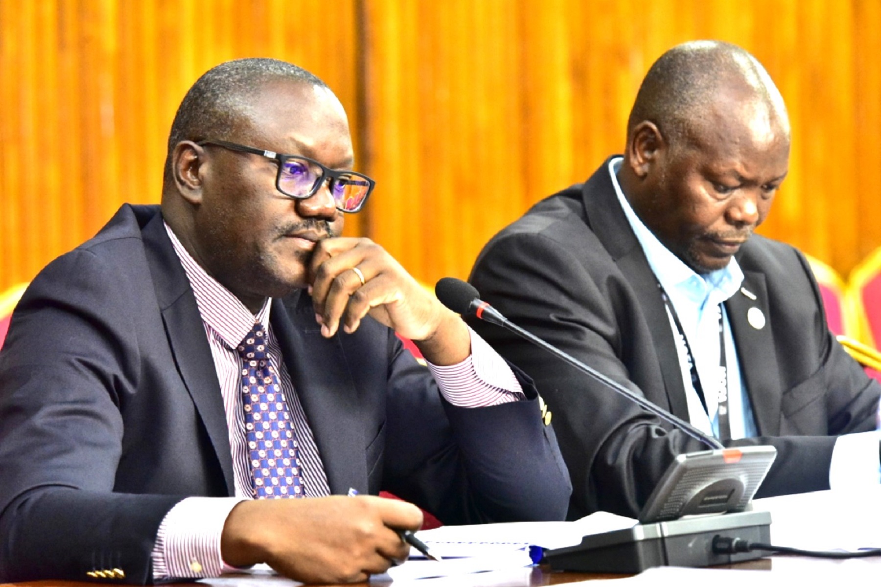 The foreign affairs Permanent Secretary, Vincent Bagiire (L) before PAC on Wednesday, 21 May 2025